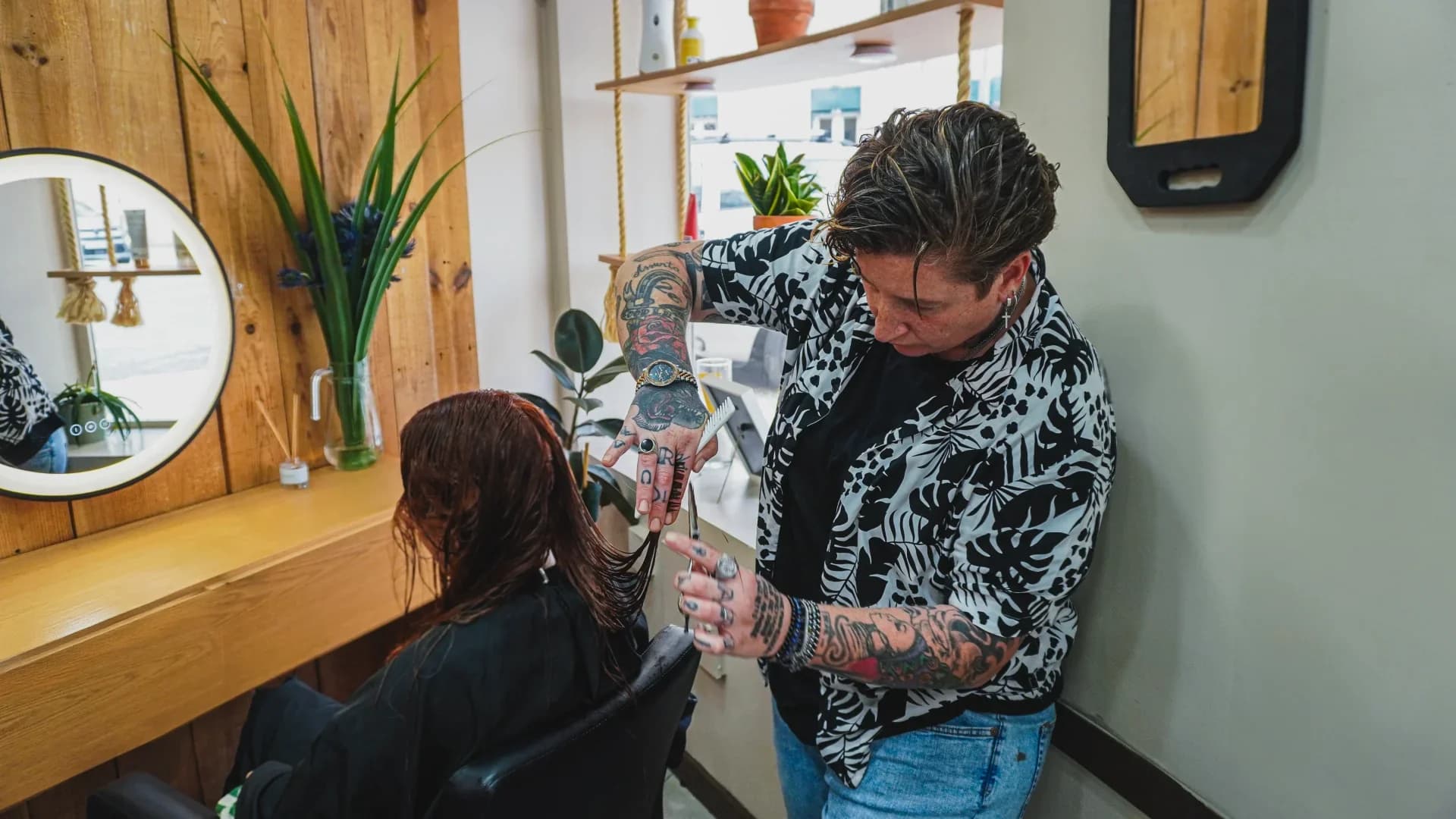 Hair stylist giving a modern womens haircut at our Lisbon salon